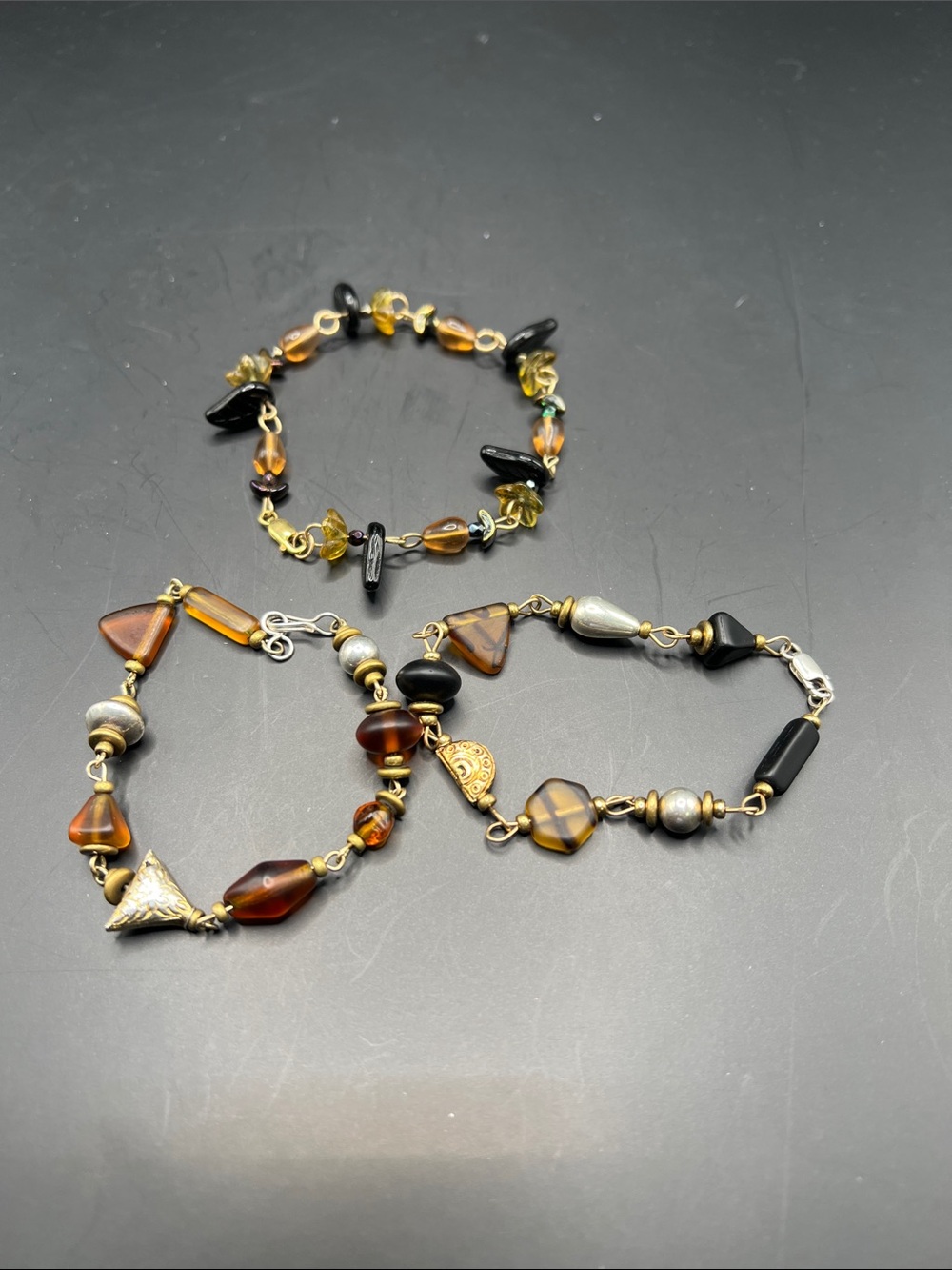 Handcrafted Amber and Black Bead Bracelets - Unbranded